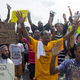 Protesters kneel in the street outside the police department in Ferguson, Mo., during a protest on Aug. 30, 2014, over the fatal shooting of Michael Brown by a police officer on Aug. 9.
Aaron P. Bernstein/Getty Images